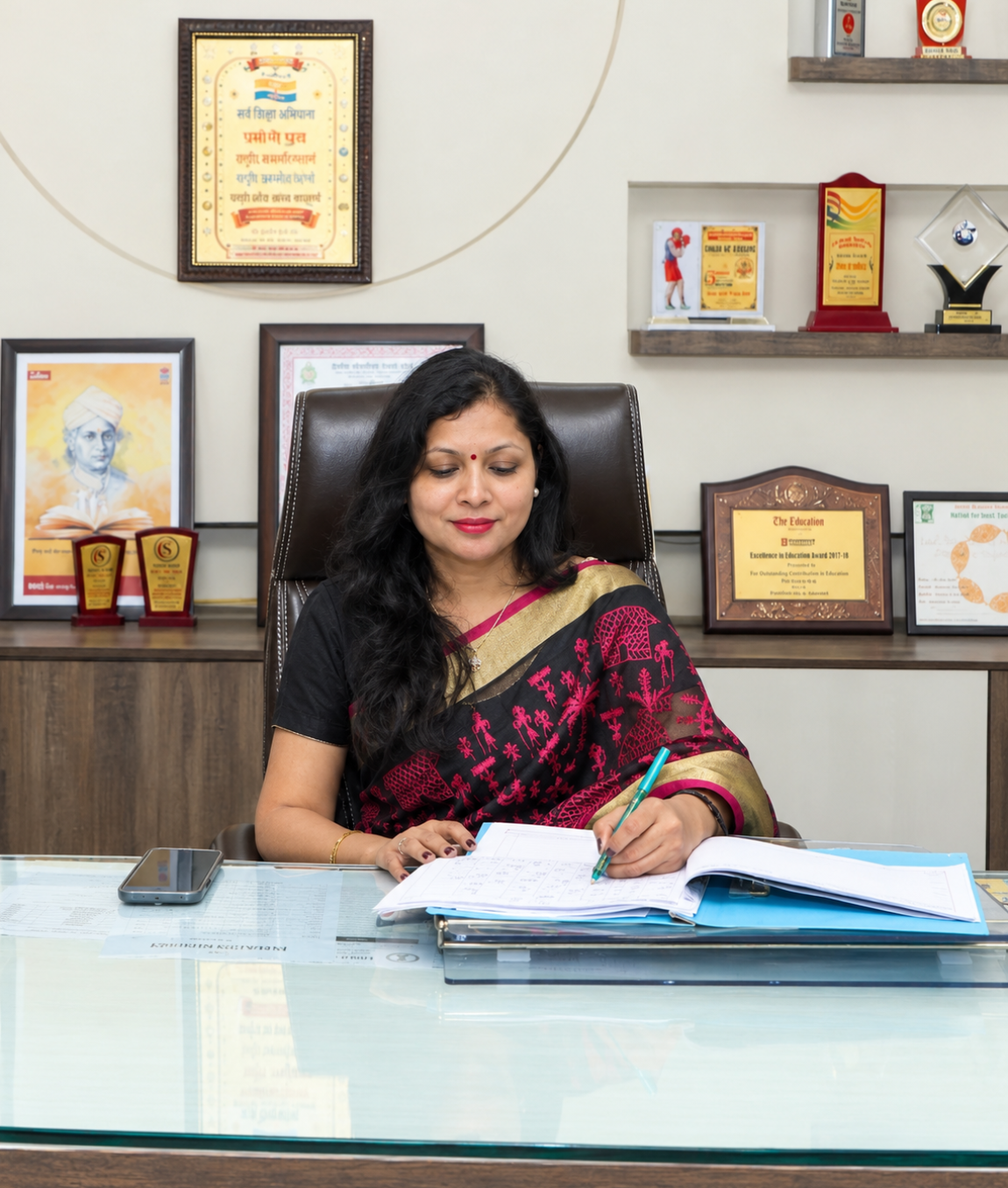 Indian Educator Completing Office Paperwork
